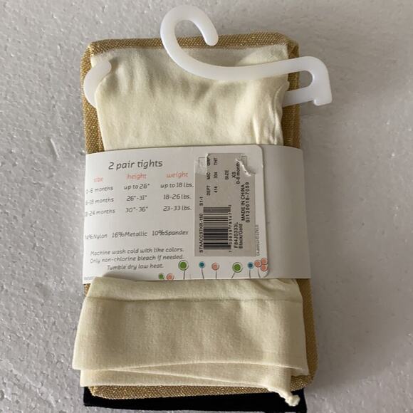 $10. 2 Pair Tight 0-6 Months Cream/Black Brand New - Picture 1 of 3